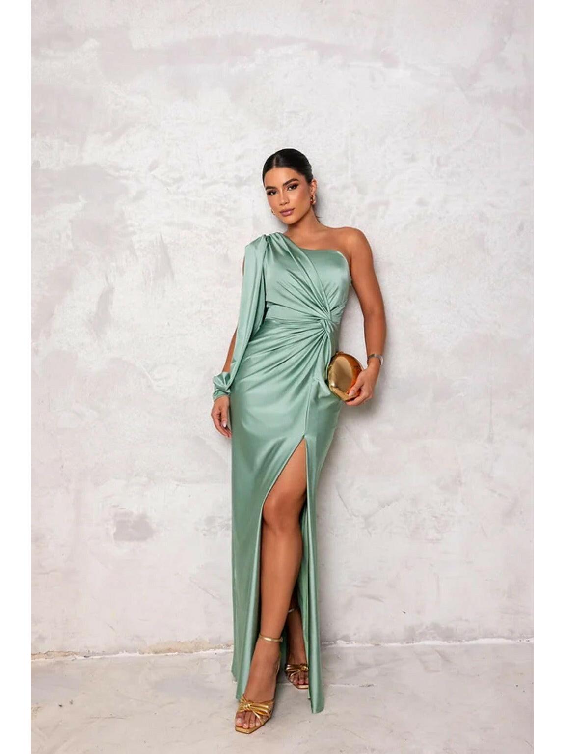 Elegant olive green satin maxi dress by Lumina Vancouver, perfect for wedding guests, with flowing fabric and sophisticated style.