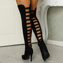 Black high heel boots for women with daring cutout design by Lumina Wear, featuring sleek ankle-high style and stiletto heels.