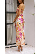 Pink Bellamy sleeveless floral maxi dress by Lumina Vancouver, perfect for wedding guests, featuring a flowing design and vibrant pattern.