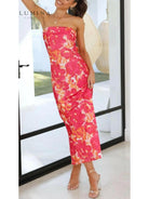 Pink Bellamy sleeveless floral maxi dress by Lumina Vancouver, perfect for wedding guests, shown on a model.