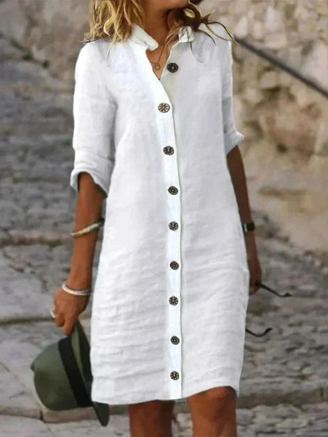 White Bellatrix shirt dress by Lumina Wear, mini button-down dress with a tailored fit and collar, styled on a model.