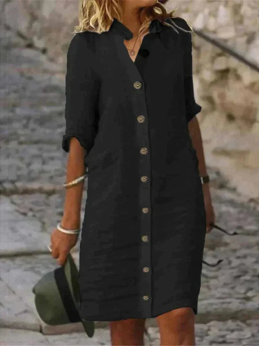 White Bellatrix shirt dress by Lumina Wear, button-down mini dress with a tailored fit and classic collar, displayed on a hanger.