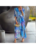Blue printed Betty evening V-neck dress by Lumina Wear, perfect for wedding guests, shown on a size 8-10 model.