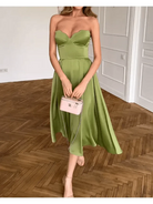 Green Ingunn strapless midi dress by Lumina Vancouver featuring a chic, form-fitting design and elegant silhouette.