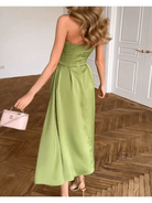 Green Ingunn strapless midi dress by Lumina Vancouver, featuring a chic, fitted silhouette and elegant design.