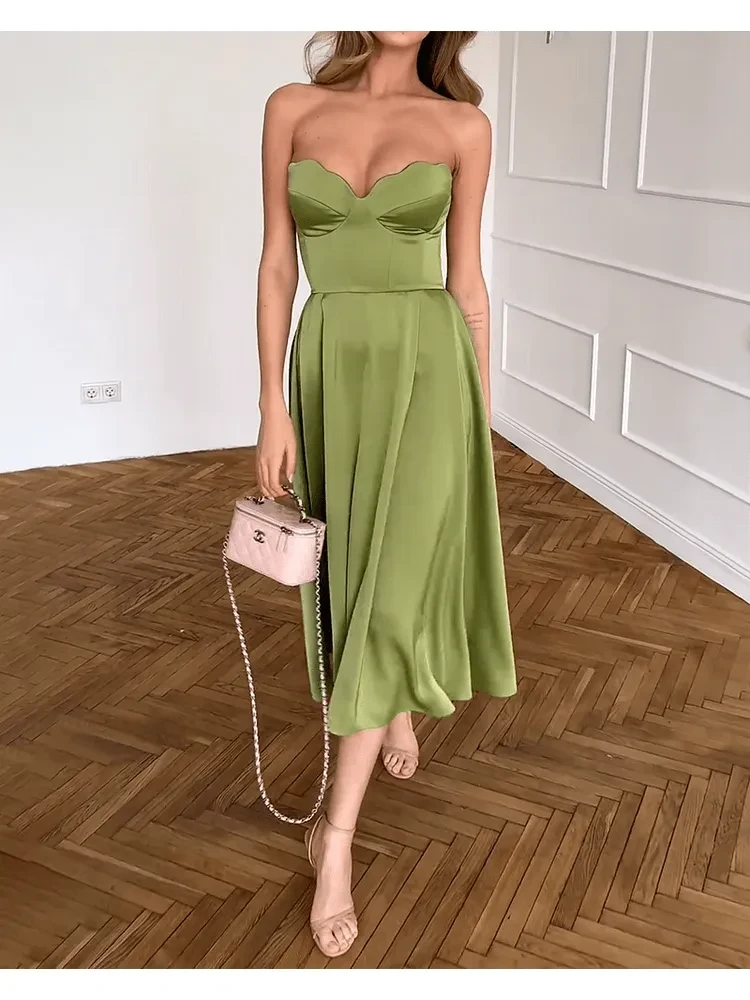 Green Ingunn chic strapless midi dress by Lumina Vancouver, showcasing a fitted waist and elegant midi length.