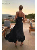 Black Lumina Wear Blair evening dress featuring a graceful flowing silhouette, perfect for wedding guest occasions.