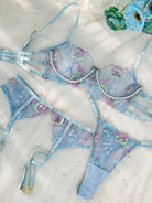Blue floral embroidery lingerie set with pearl chain details, 3-piece set from Lumina Vancouver, featuring delicate lace and elegant design.