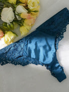 Blue lace satin mesh push-up lingerie set with matching bra, panties, and garter belt from Lumina Vancouver, 3-piece sexy lingerie.