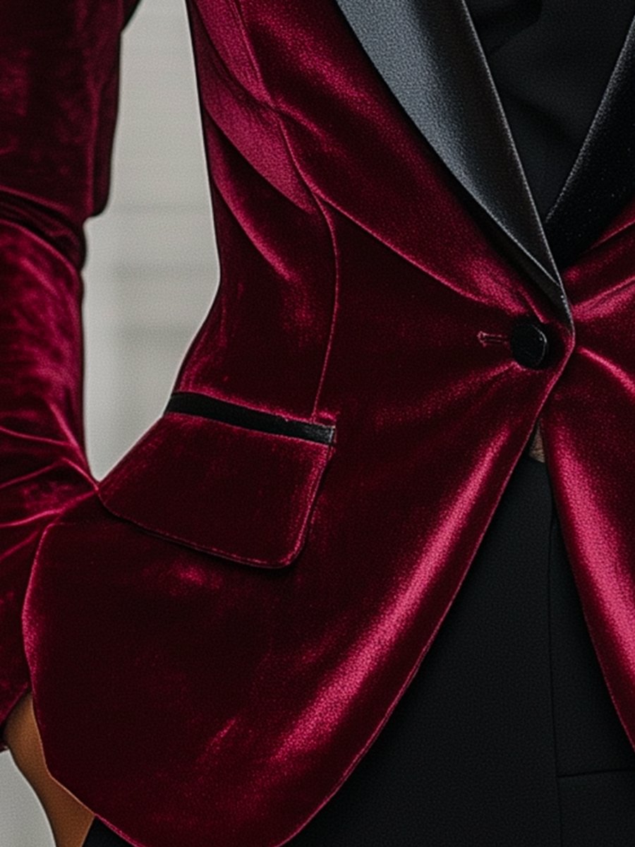 Burgundy velvet blazer by Lumina Wear with satin lapels and black rose detail, shown on a hanger.