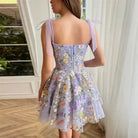 Light purple Calista sleeveless embroidered mini dress by Lumina Vancouver displayed on a hanger.