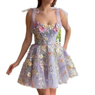 Light purple Calista sleeveless embroidered mini dress by Lumina Vancouver displayed on a hanger.