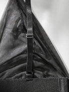 Lumina Vancouver Emmanuelle Bodysuit, close-up of sleek black bodysuit with fitted style and subtle detailing.