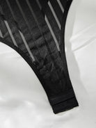 Lumina Vancouver Emmanuelle Bodysuit in sleek fabric, featuring a fitted design and stylish neckline.