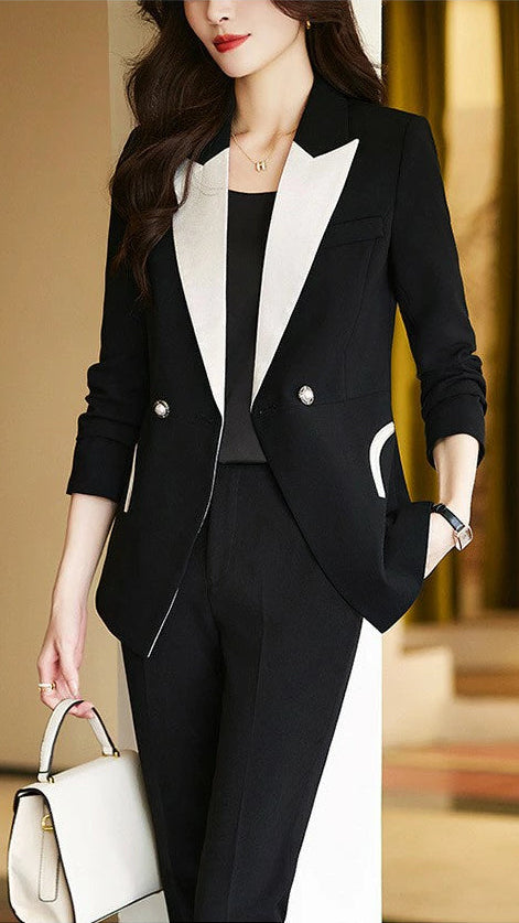 Black Camille monochrome tailored pant suit set by Lumina Vancouver, featuring a sleek, structured design with matching pants and blazer.