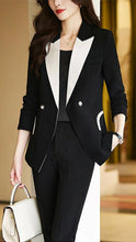 Black monochrome tailored pant suit set by Lumina Wear featuring a sleek, structured design for a sophisticated professional look.