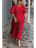 Red Carla puff-sleeve dress by Lumina Wear featuring elegant design, showcased on a model against a neutral background.