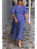 Red Carla elegant puff-sleeve dress by Lumina Wear, featuring a fitted bodice and flowing skirt for stylish occasions.