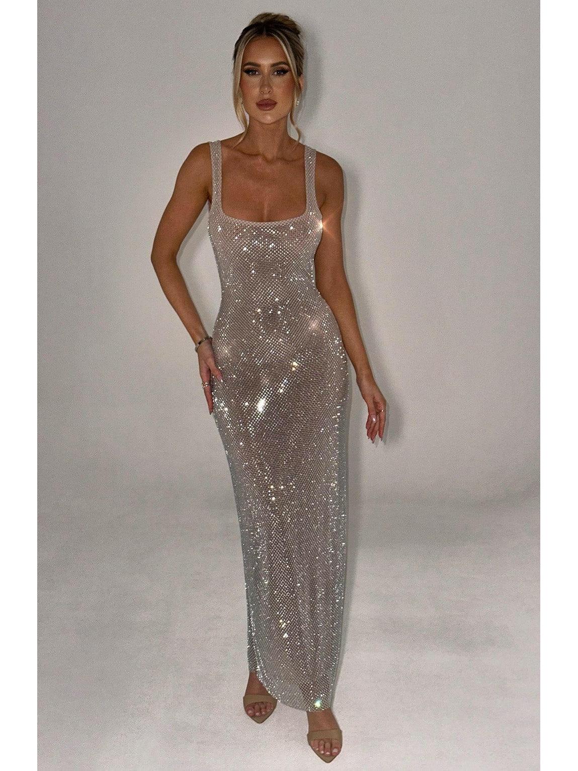 Lumina Wear Catherine sparkling maxi dress in elegant black, showcasing its shimmering fabric and flowing silhouette.