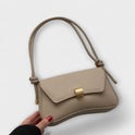 Lumina Wear Cécile sleek mini shoulder bag in terracotta with elegant design, featuring a compact silhouette and stylish details.
