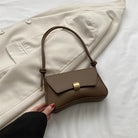 Lumina Wear Cécile mini shoulder bag in terracotta with sleek, elegant design, perfect for stylish everyday use.