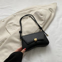 Lumina Wear Cécile sleek mini shoulder bag in terracotta with elegant design, featuring smooth leather and a compact silhouette.