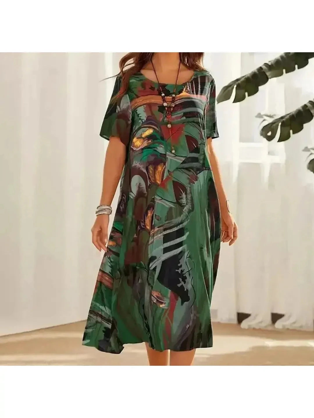 Elegant multi-color floral dress by Lumina Vancouver, featuring a flowing design and vibrant floral pattern in shades of blue.
