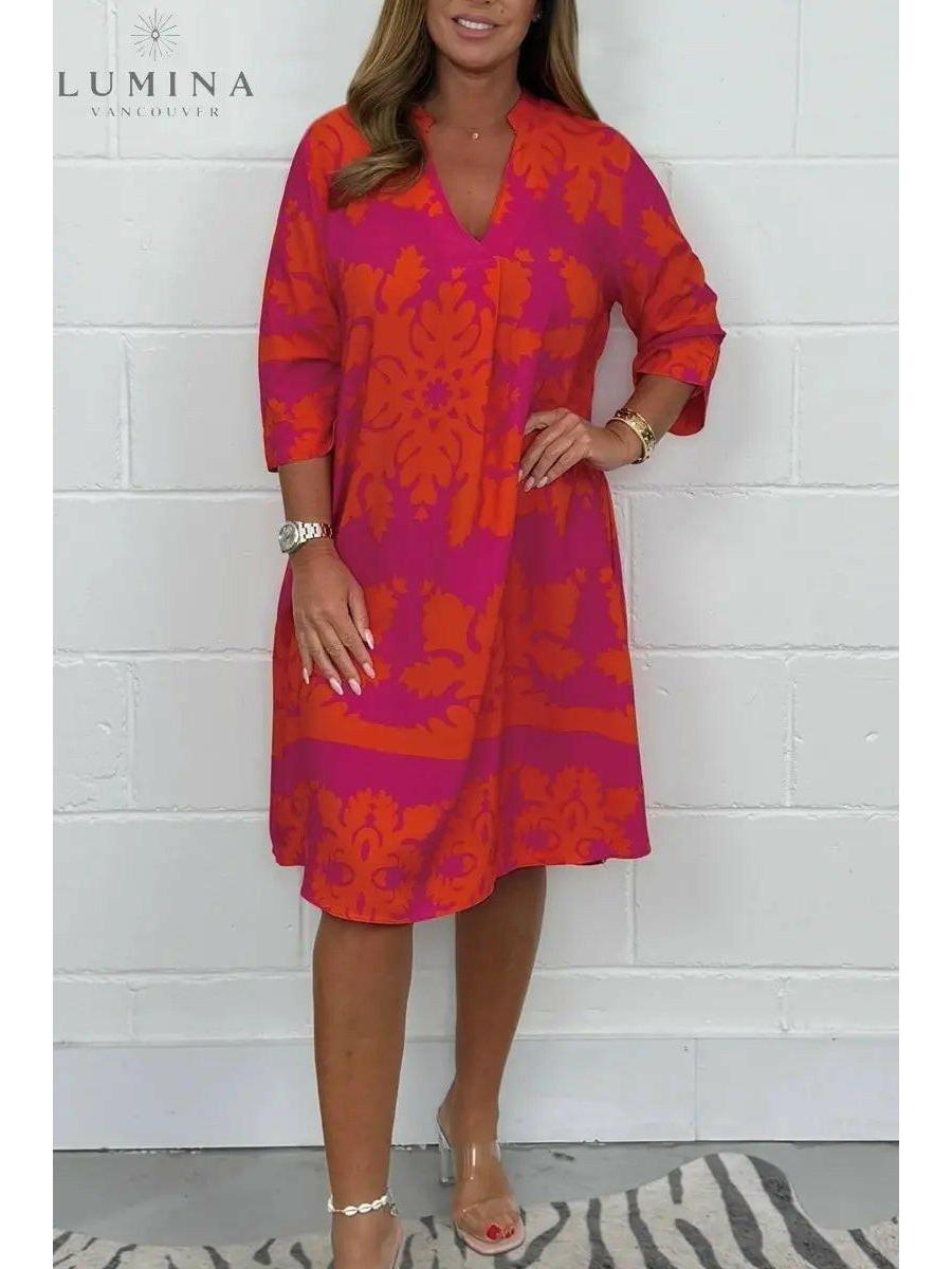 Blue and army green Bergljot spring dress by Lumina Vancouver, featuring a comfortable fit and floral pattern.