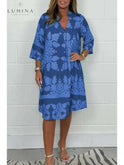 Blue and army green Bergljot spring dress by Lumina Wear, featuring a casual, flowy design with floral accents.