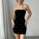 Black Celestia strapless velvet mini dress by Lumina Vancouver, shown on a model with a fitted silhouette and elegant style.