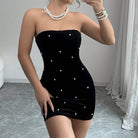 Black strapless velvet mini dress from Lumina Vancouver's Celestia collection, shown on a mannequin.