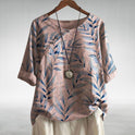 Blue Charlotte Breezy Leaf Print Blouse by Lumina Wear with button-up design and lightweight, flowing fabric.
