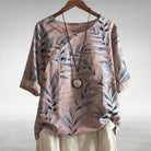 Blue Charlotte Breezy Leaf Print Blouse by Lumina Wear with button-up design, lightweight fabric, and relaxed fit.
