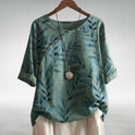 Blue Charlotte Breezy Leaf Print Blouse with button-up design by Lumina Wear, featuring lightweight fabric and relaxed fit.