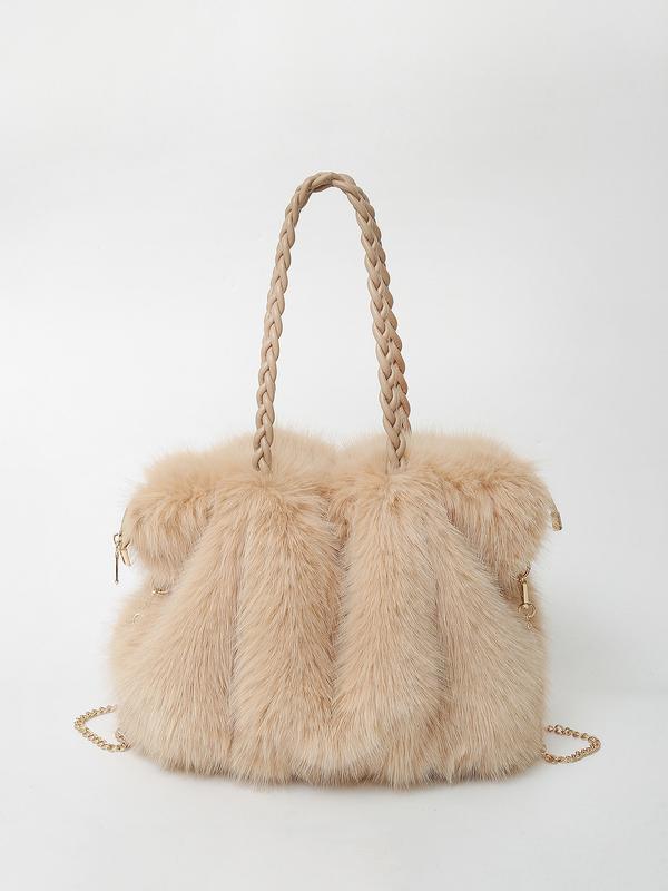 Luxurious plush velvet tote bag by Lumina Wear, spacious design, elegant brown handbag with stylish handles and detailed stitching.