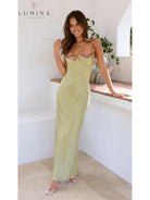Lime Chelsey maxi dress with flower detail for wedding guest, by Lumina Vancouver, featuring elegant floral accents and flowing fabric.