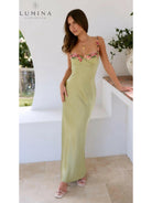 Lime Chelsey maxi dress with flower details by Lumina Vancouver, perfect for wedding guest attire, shown on a model.