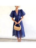 Pink Cindy puff sleeve midi dress by Lumina Wear featuring a classic patterned design and elegant midi length.