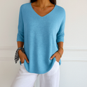 Dark gray Clara Lumina Wear relaxed V-neck sweater for women featuring a minimalist design and comfortable fit.