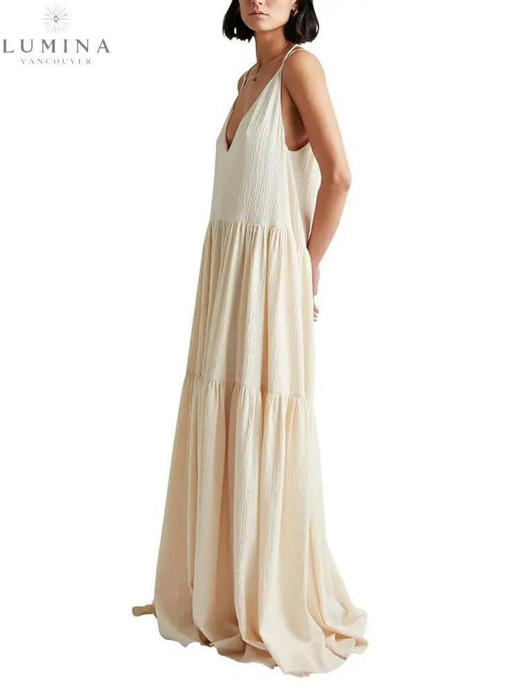 White Clarissa Ocean Breeze Maxi Dress by Lumina Vancouver, perfect for holiday vibes, shown on a model.