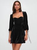 Maroon velvet mini dress with puff sleeves by Lumina Wear, featuring a fitted silhouette and stylish design.