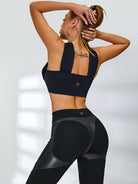 Black Cross Super Lift Sports Bra by Lumina Vancouver, supportive athletic bra with cross strap details for active wear.