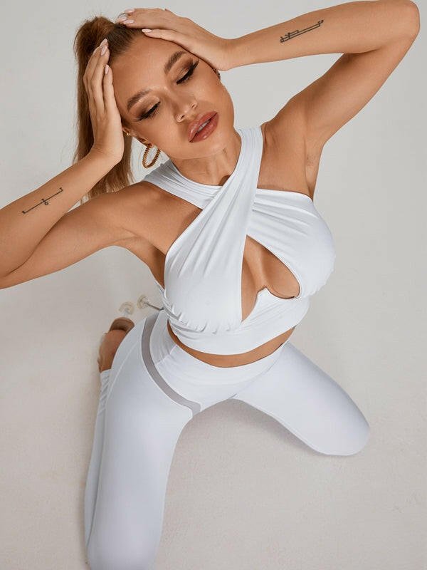 White Cross Super Lift Sports Bra from Lumina Vancouver, showing the supportive cross-back design and breathable fabric.