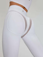 White Cross Super Lift Sports Bra by Lumina Vancouver, designed for support and comfort during athletic activities.