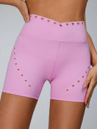 Pink Lumina Vancouver cutout tailoring sports bra featuring sleek design and supportive fit for active wear.