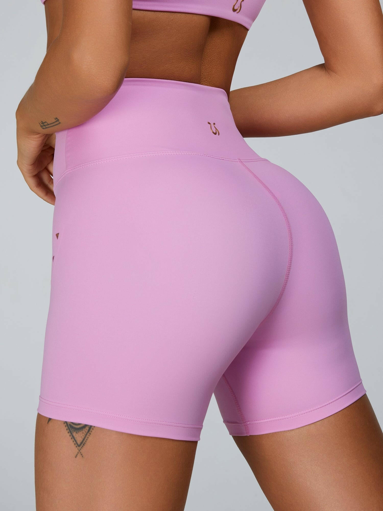 Pink Lumina Vancouver sports bra with cutout tailoring and supportive design, ideal for activewear and workouts.