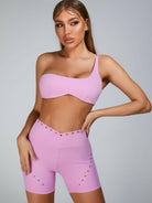 Pink Lumina Vancouver sports bra with stylish cutout tailoring, designed for active wear and comfortable fit.