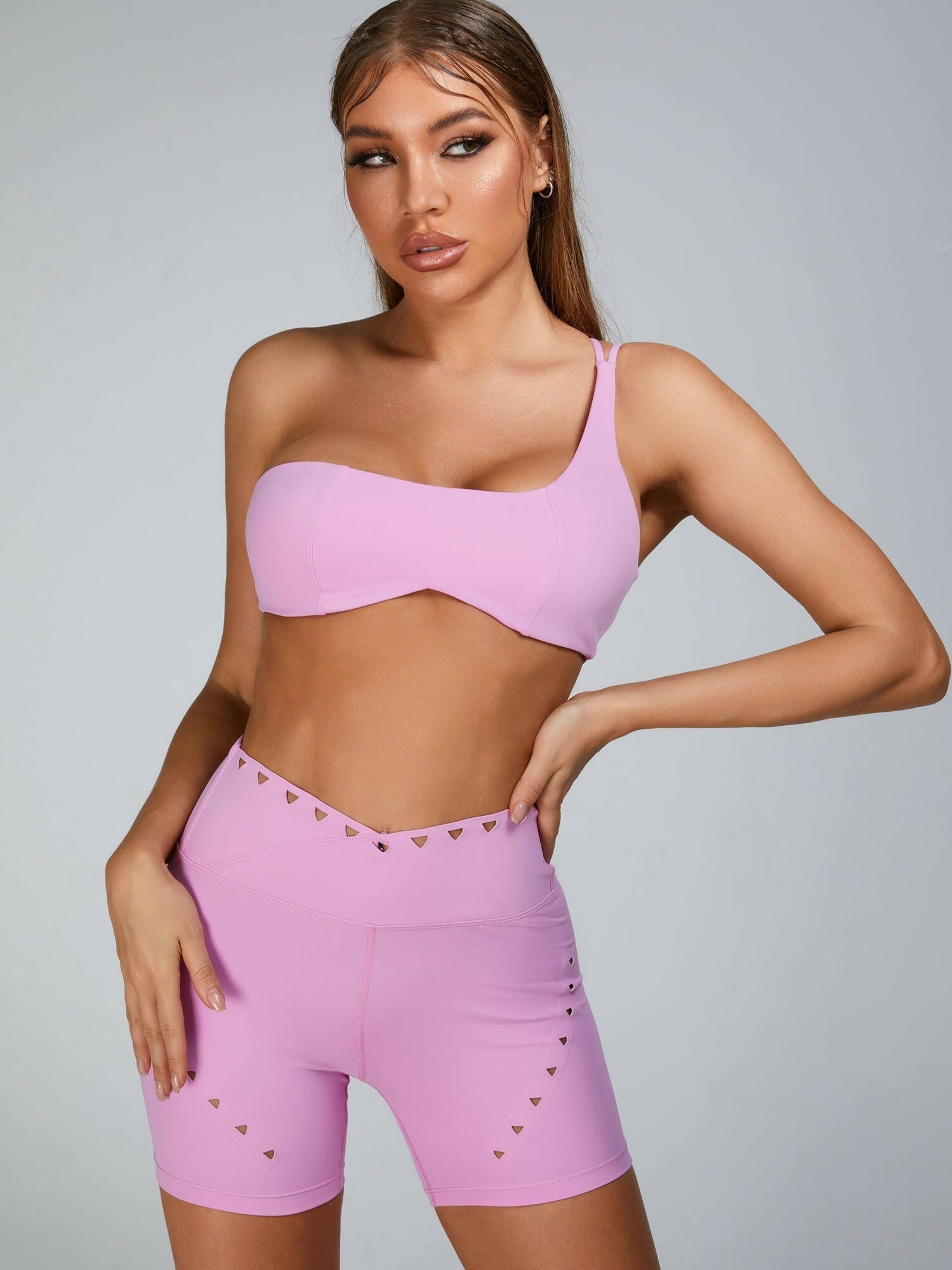 Pink Lumina Vancouver sports bra with stylish cutout tailoring, designed for active wear and comfortable fit.