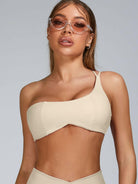 Pink Lumina Vancouver sports bra with cutout tailoring design, featuring supportive straps and a sleek, modern fit.