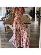 Blue Dahlia™ floral maxi dress by Lumina Vancouver, flowing fabric, elegant design, perfect for summer or special occasions.